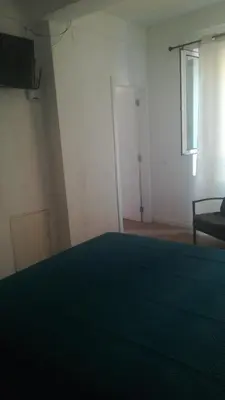 a room with a bed and a window and a door at Cc39 -Q1 in Funchal