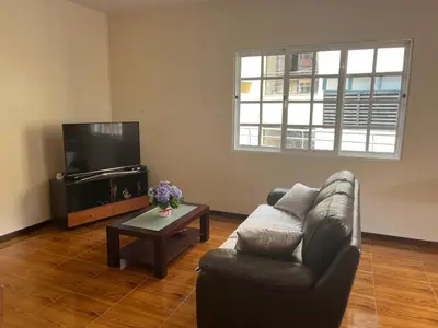 a living room with a couch and a coffee table at Vivenda da Praia in Machico