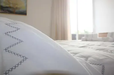 a close up of a white bed in a room at Lugar dos Louros 2 in Estreito da Calheta