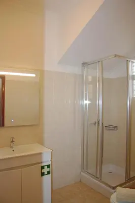 a bathroom with a shower and a sink at Lugar dos Louros 1 in Estreito da Calheta