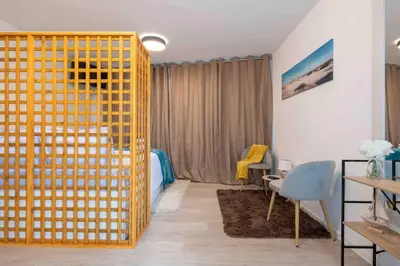 a living room with a yellow gate in a room at By the Sea III Lido - com piscina in Funchal