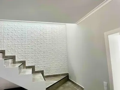 a bedroom with a white bed and a window at Casa Yeni modern two bedrooms in Arco da Calheta