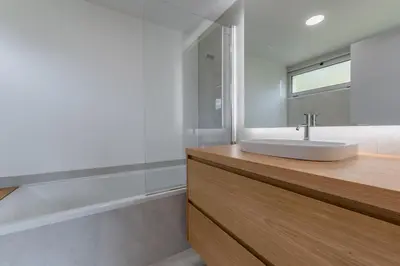a bathroom with a sink and a mirror at Villa 65 - City Edge Retreat in Funchal