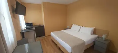 a hotel room with a bed and a television at Calheta Countryside in Calheta