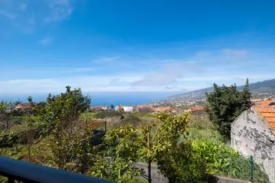 a view of the ocean from the balcony of a house at The Red Nest by GALMI in Arco da Calheta