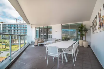 a kitchen with a counter with a tv on it at The Stylish Apt. of Madeira Palace CC in Funchal