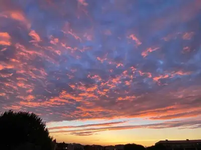 a cloudy sky at sunset with at Beautiful 2 bed townhouse on Boavista golf course in Lagos