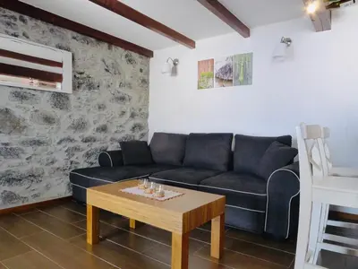 a living room with a couch and a coffee table at Atlantis Country House in Calheta