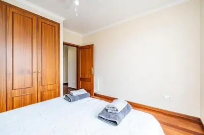 a bedroom with a bed with two towels on it at Bela Vista Valley in Calheta