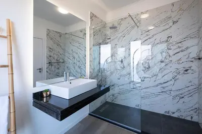 a bathroom with a sink and a mirror at Villa Bela Horizonte by GALMI in Caniço
