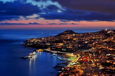 an aerial view of a city at night at SUPER Central - Deep Blue in Funchal