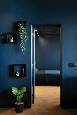 a blue room with a bed and a potted plant at SUPER Central - Deep Blue in Funchal