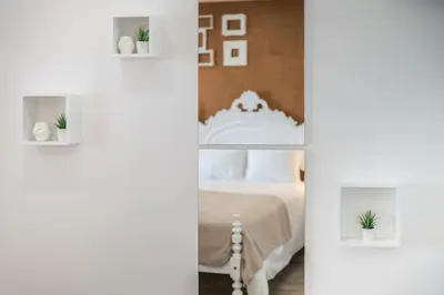 two pictures of a bedroom with a bed at SUPER Central - Cork in Funchal