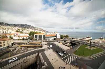 a street in a city with the ocean in the background at SUPER Central - Cork in Funchal