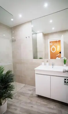 a bathroom with a white sink and a mirror at SUPER Central - Cork in Funchal