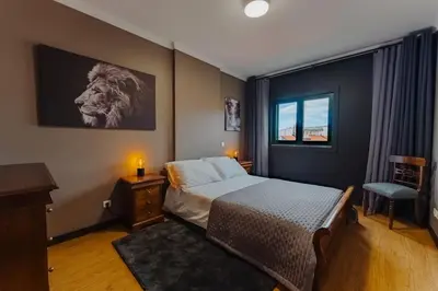 a bedroom with a bed and a lion on the wall at SUPER Anadia - Golden in Funchal