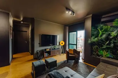 a living room with a couch and a tv at SUPER Anadia - Golden in Funchal