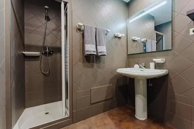 a bathroom with a sink and a shower at SUPER Anadia - Golden in Funchal