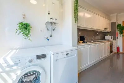 a white washer and dryer in a kitchen at SUPER Anadia - Olive in Funchal