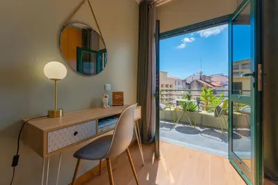 a home office with a desk and a mirror at SUPER Anadia - Olive in Funchal