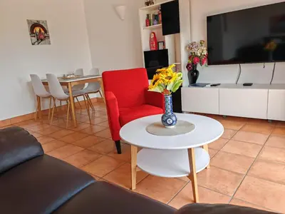 a kitchen with white cabinets and a refrigerator at Vila Apostol in Lagos