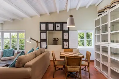 a living room with a couch and a table at Rabaçal Nature Spot Cottage in Estreito da Calheta