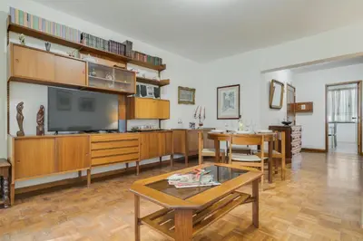 a living room with a tv and a table at Refugio Madeirense by Atlantic Holiday in Funchal