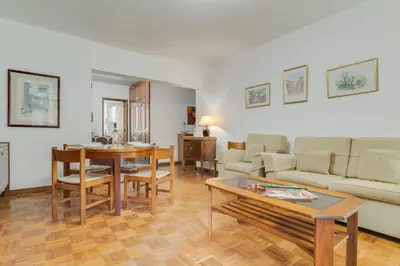 a living room with a couch and a table at Refugio Madeirense by Atlantic Holiday in Funchal