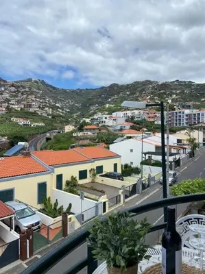a view of a city from a balcony at Residência Azevedo in Câmara de Lobos