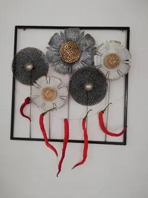 a picture of three flowers on a wall at FXapartment1 in Funchal