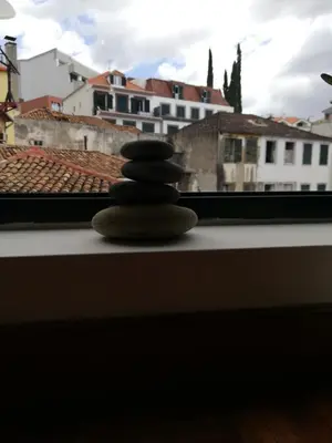 a stack of rocks sitting on a window sill at FXapartment1 in Funchal