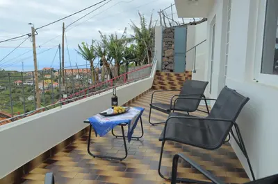 a car parked in front of a white house at Fifty`s House 1 By Sam Houses in Ribeira Brava