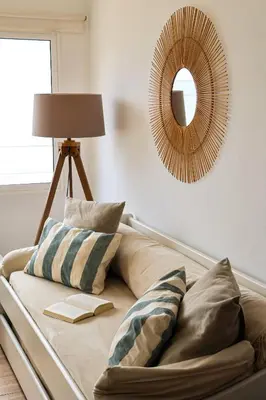 a room with a couch with a lamp and a mirror at Seashore Villa - Porto Santo in Porto Santo