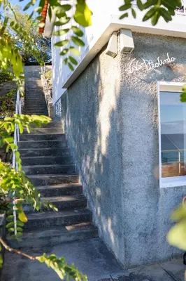 a stairway leading up to a building with a window at Seashore Villa - Porto Santo in Porto Santo