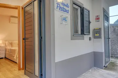 a door leading to a room with a bedroom at Casa Familia Pestana 1, a Home in Madeira in Seixal