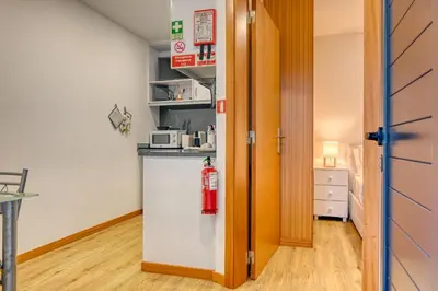 a kitchen with a fire extinguisher on the counter at Casa Familia Pestana 1, a Home in Madeira in Seixal
