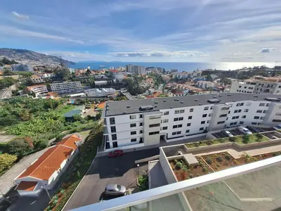 an overhead view of a city with a white building at Koala Bay Place in Funchal