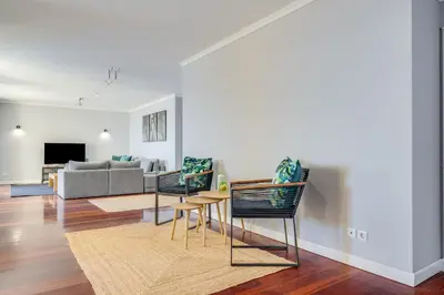 a living room with a couch and a table and chairs at Apartament Falesia Paradise by Holiday Rental Madeira in Funchal