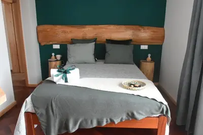 a bedroom with a bed with a box on it at Vale dos Ilhéus in Machico