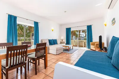 a living room with a bed and a couch at Vilamos in Lagos by Algarve Golden Properties in Lagos