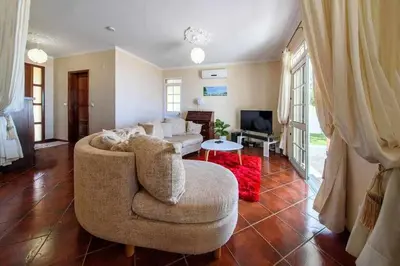 a living room with a couch and a tv at Casa do Tornadouro by Mth in Ponta do Sol