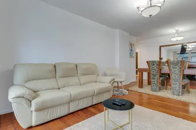 a living room with a white couch and a table at Ramos Apartment by Holiday Rental Madeira in Funchal