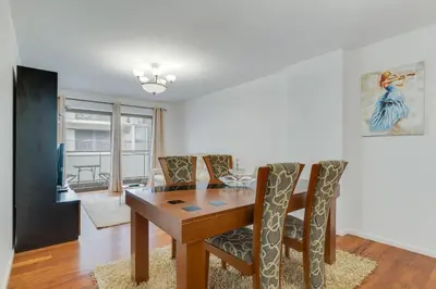 a dining room with a wooden table and chairs at Ramos Apartment by Holiday Rental Madeira in Funchal