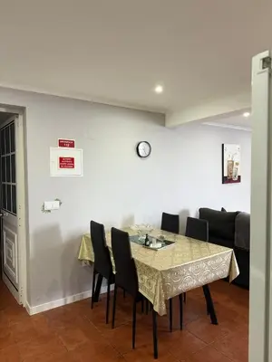 a dining room with a table and chairs at Gouveia Family Escape in Machico