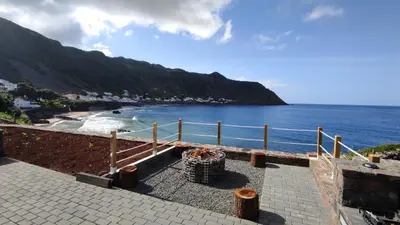 a view of a beach with the ocean at Casa da Ponta Negra in Vila do Porto