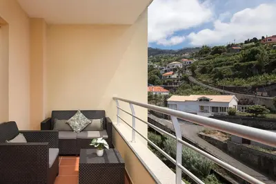 a balcony with a view of a city at Apartamento Vale e Mar in Calheta