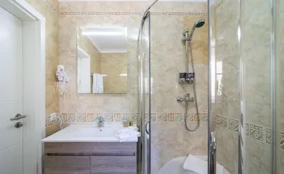 a bathroom with a shower and a sink at Villa Ílios - Porto de Mós, Lagos in Lagos