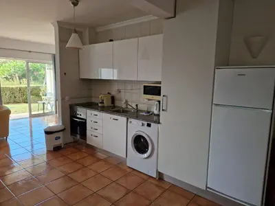 a kitchen with a white refrigerator and a dishwasher at Amazing Studio with Ocean View in Lagos