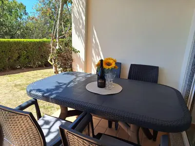 a black table with a vase of flowers on it at Amazing Studio with Ocean View in Lagos