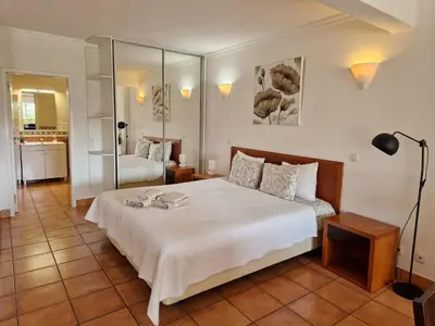 a bedroom with a large white bed in a room at Amazing Studio with Ocean View in Lagos